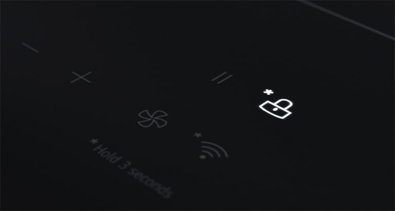 This is a close-up image of the "Lock icon" LED light that can be set so that the control panel of the induction hob is not touched.