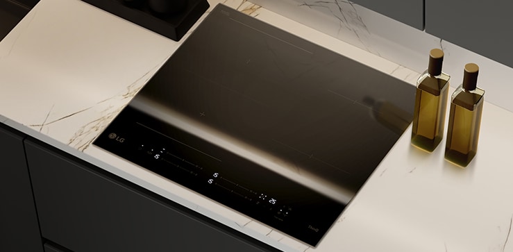 This image shows the glossy black glass finish of the induction hob.