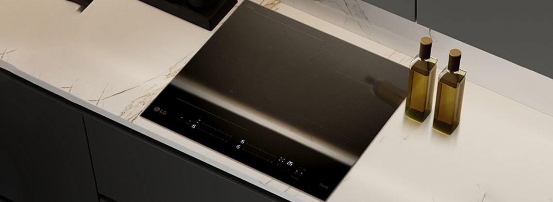 This image shows the glossy black glass finish of the induction hob.