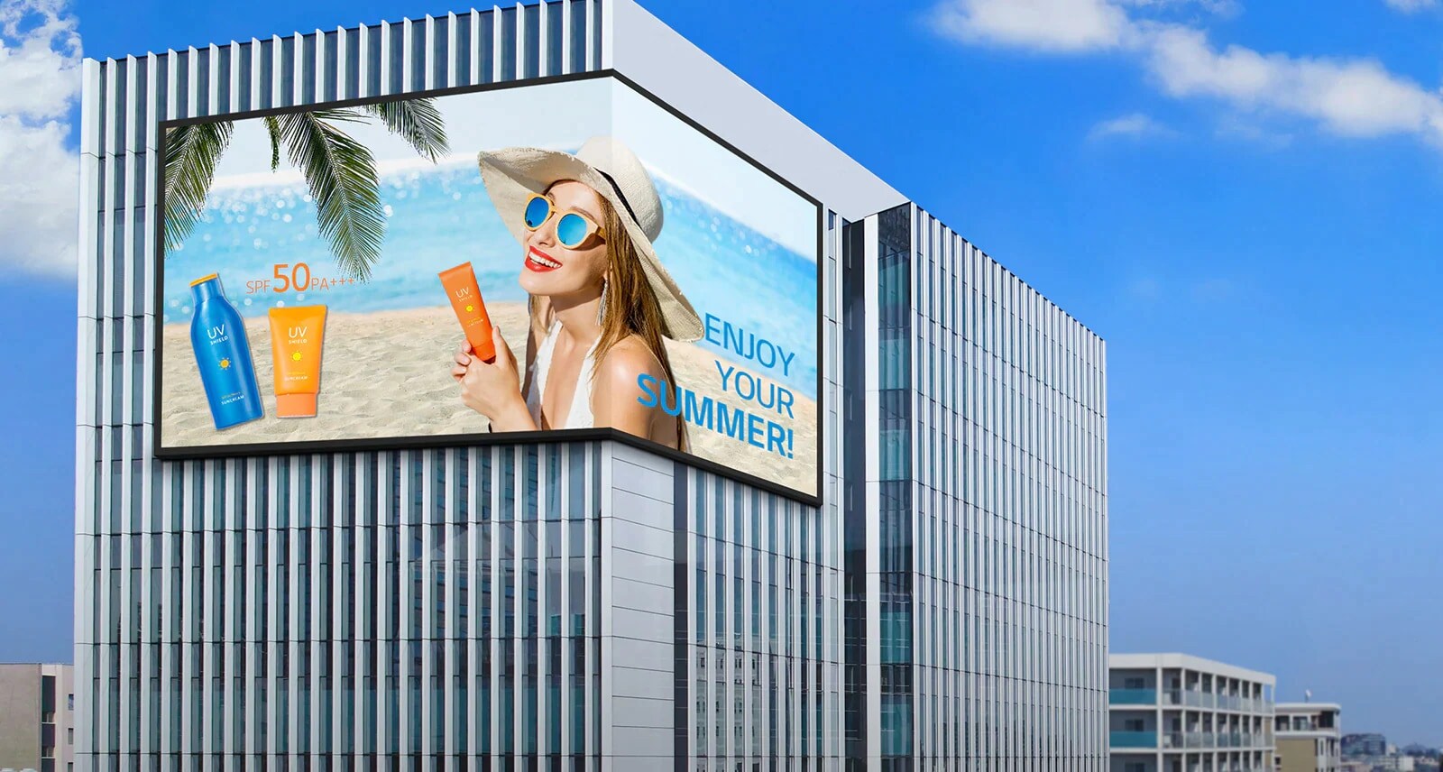 There is a screen installed on the corner of the building.