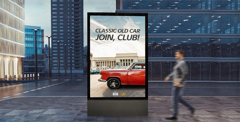 A display as tall as a person is installed at eye level on the street.