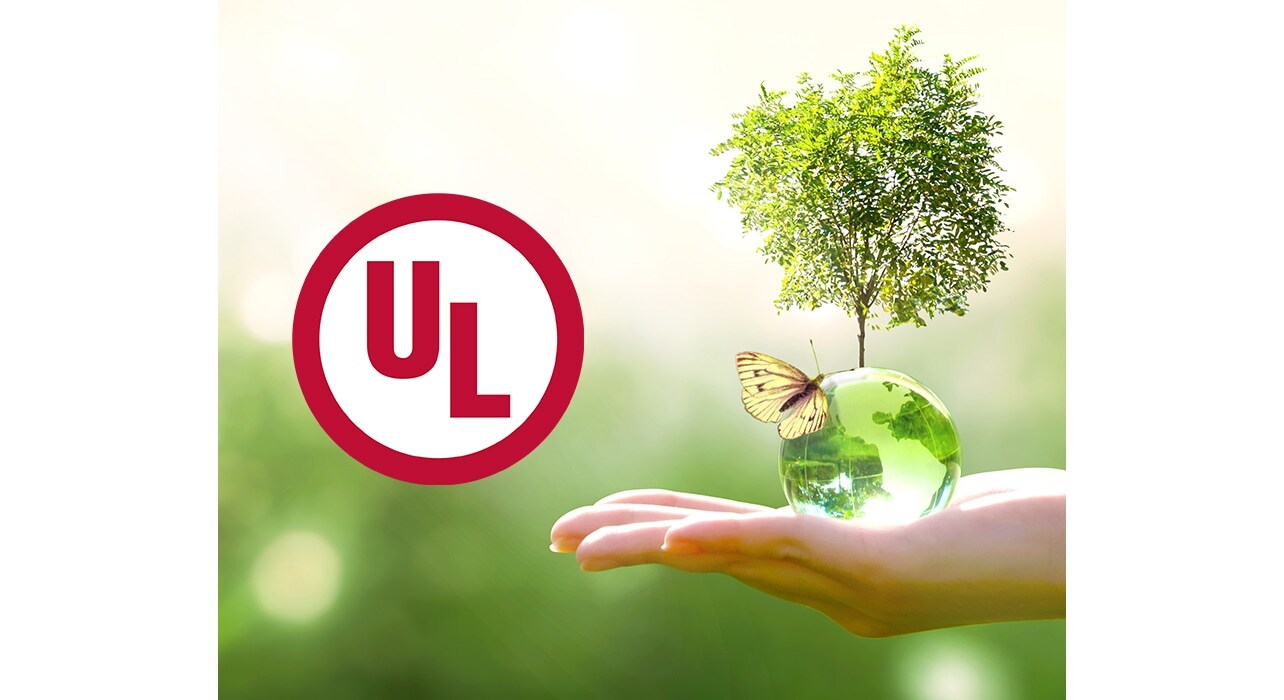 A logo of UL and a person holding a small tree with a butterfly on it.