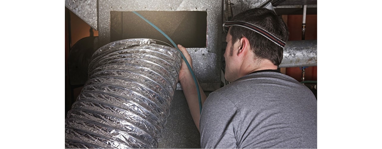 The man next to the pipe.