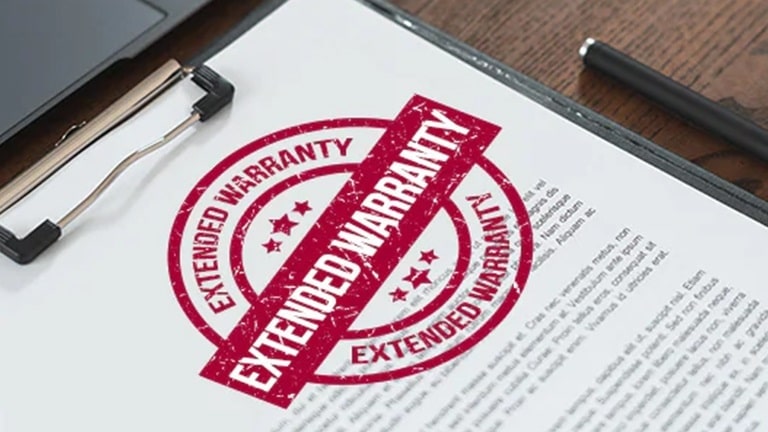 A paper with a "Extended Warranty" stamp.