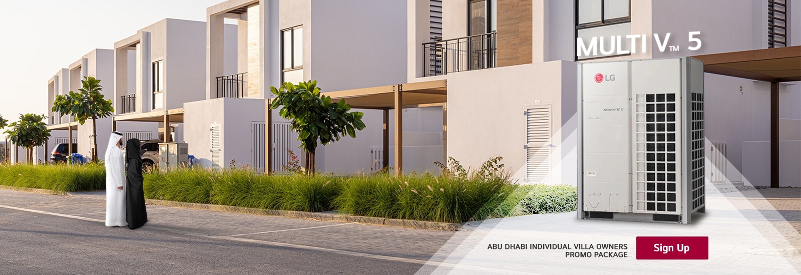 LG Multi V TM 5 HVAC unit prominently displayed in a modern residential setting, flanked by a man and woman in traditional attire, with stylish villas lining the street.