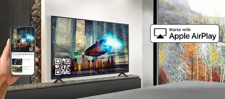 A hotel guest is pairing their iPhone with the in-room TV through AirPlay.