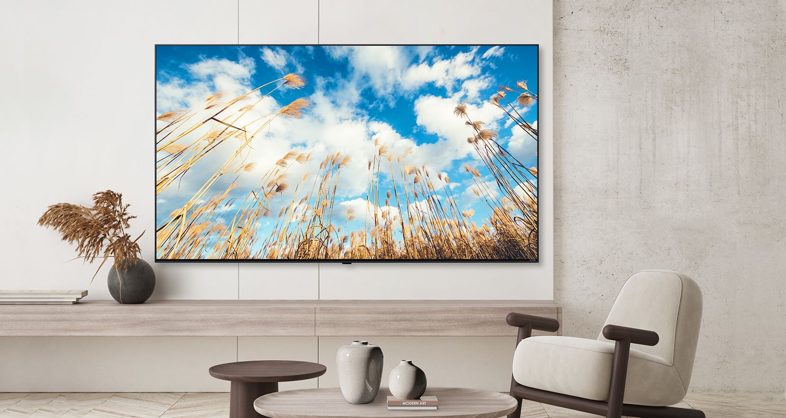 A TV on a hotel’s wall shows a bright and vivid screen.
