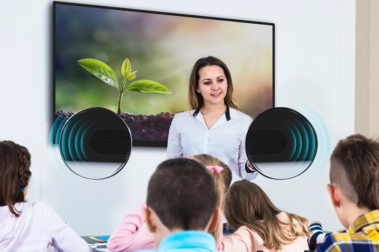 The teacher is teaching the students in class and the students are listening to the sounds from the TR3DJ.