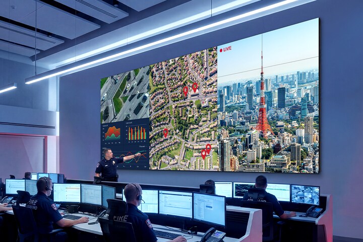 A video wall is installed in a control room, with the screen divided into multiple sections to display various types of information, including regional conditions and data, for monitoring.