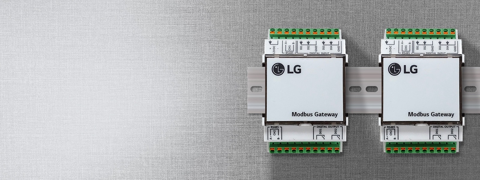 Two LG Modbus Gateway devices mounted on a wall, labeled for easy integration of LG air conditioners with building systems.