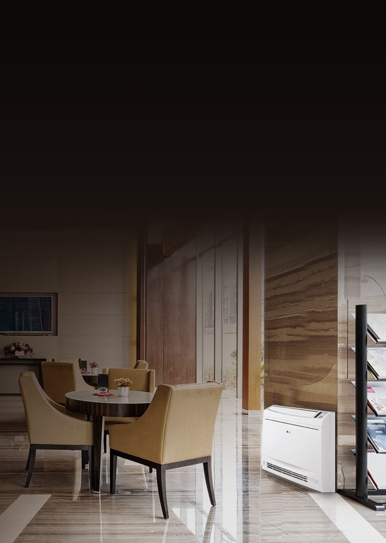 An LG Console unit sits at the base of a pillar in a cafeteria area with caramel chairs and a table.