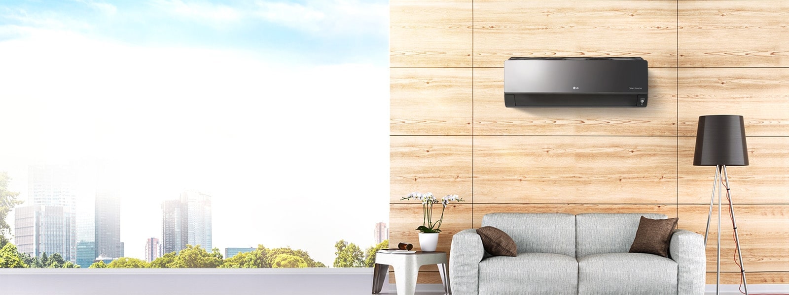 LG HVAC wall-mounted air conditioner unit with a black design in a modern room featuring a wooden wall and grey sofa.