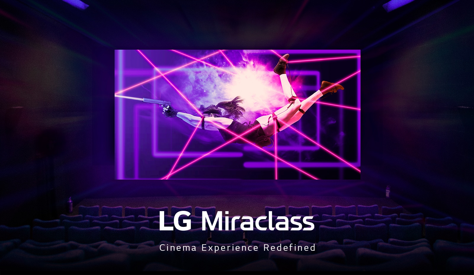 A large LED screen is showing a colorful and lively action scene at the movie theater.