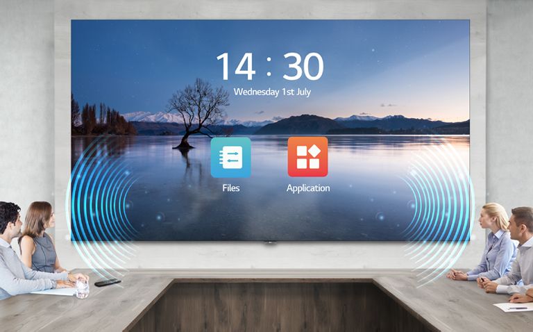 People have a meeting while watching the display and listening sound with the LAEC and its built-in speaker, installed in the meeting room.