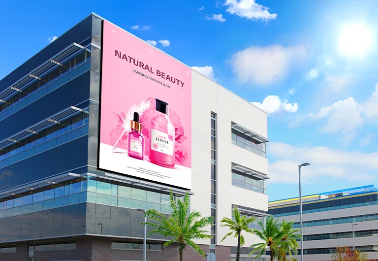 A large LED is installed on the building. The sun is shining brightly, but the LED screen’s advertisement is clearly visible.