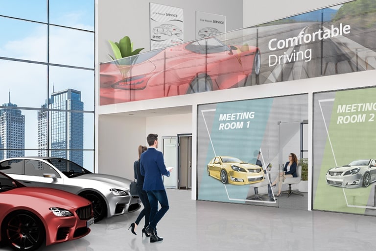 Transparent LED films are attached to the offices’ glass walls and the handrail glass inside the car dealership, and they are showing car advertisements well.