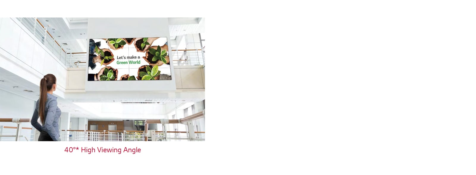 A woman is looking up at the screen installed upstairs.