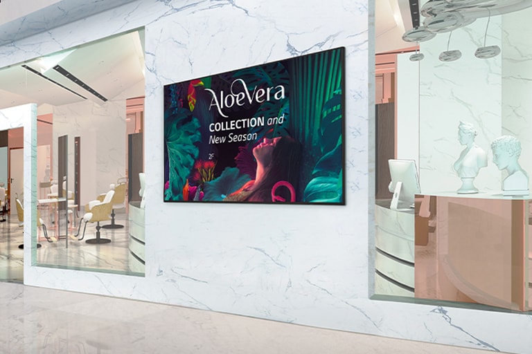 Signage installed on the interior walls of the shopping mall displays advertisements vividly.