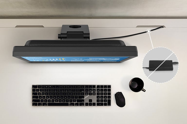 A clean and efficiently used desk because of LG SXGA touchscreen monitor with built-in power.	