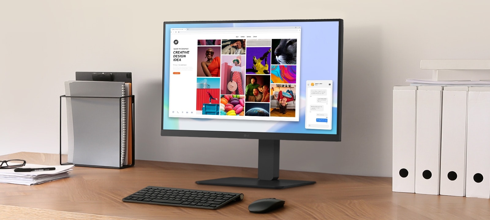 A workspace on a desk with a monitor and document holder.	