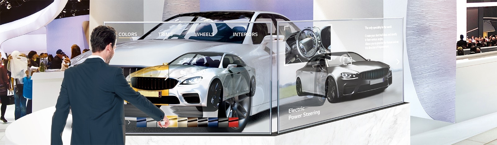 In a car exhibition hall, a man is changing the car’s color on the screen by touching the Transparent OLED Signage screen installed in front of the car.