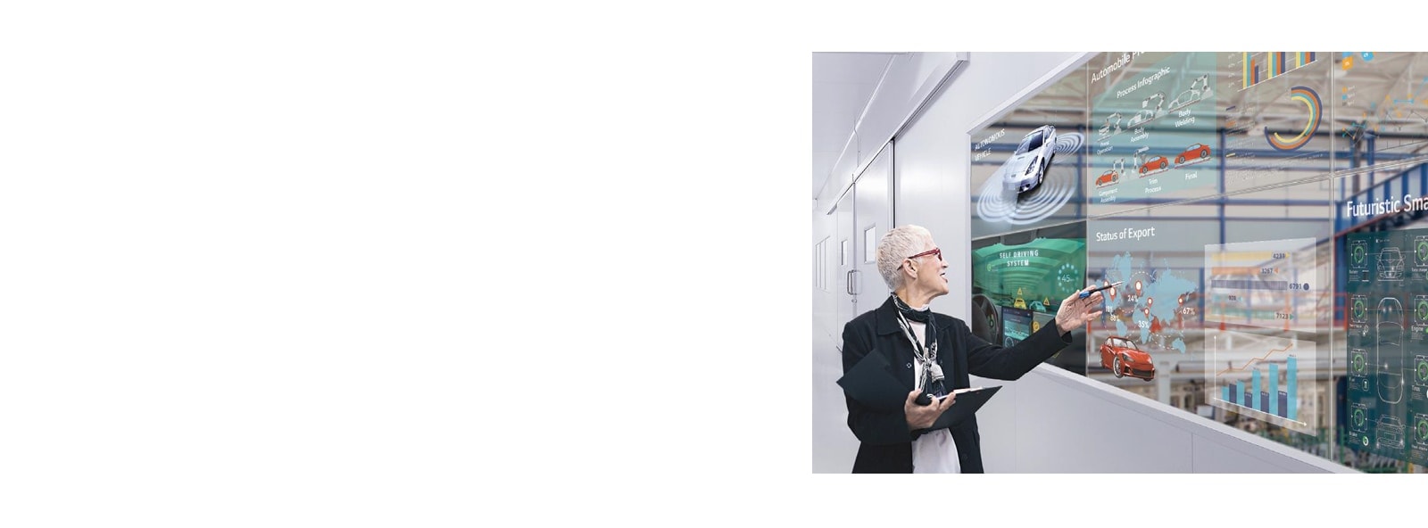 A woman reviews her work by looking at it on the transparent OLED screens installed on the office windows.