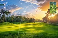 A virtual golf ball is in mid-flight with a stunning sunset on a green golf course and an overhead course map displayed.	