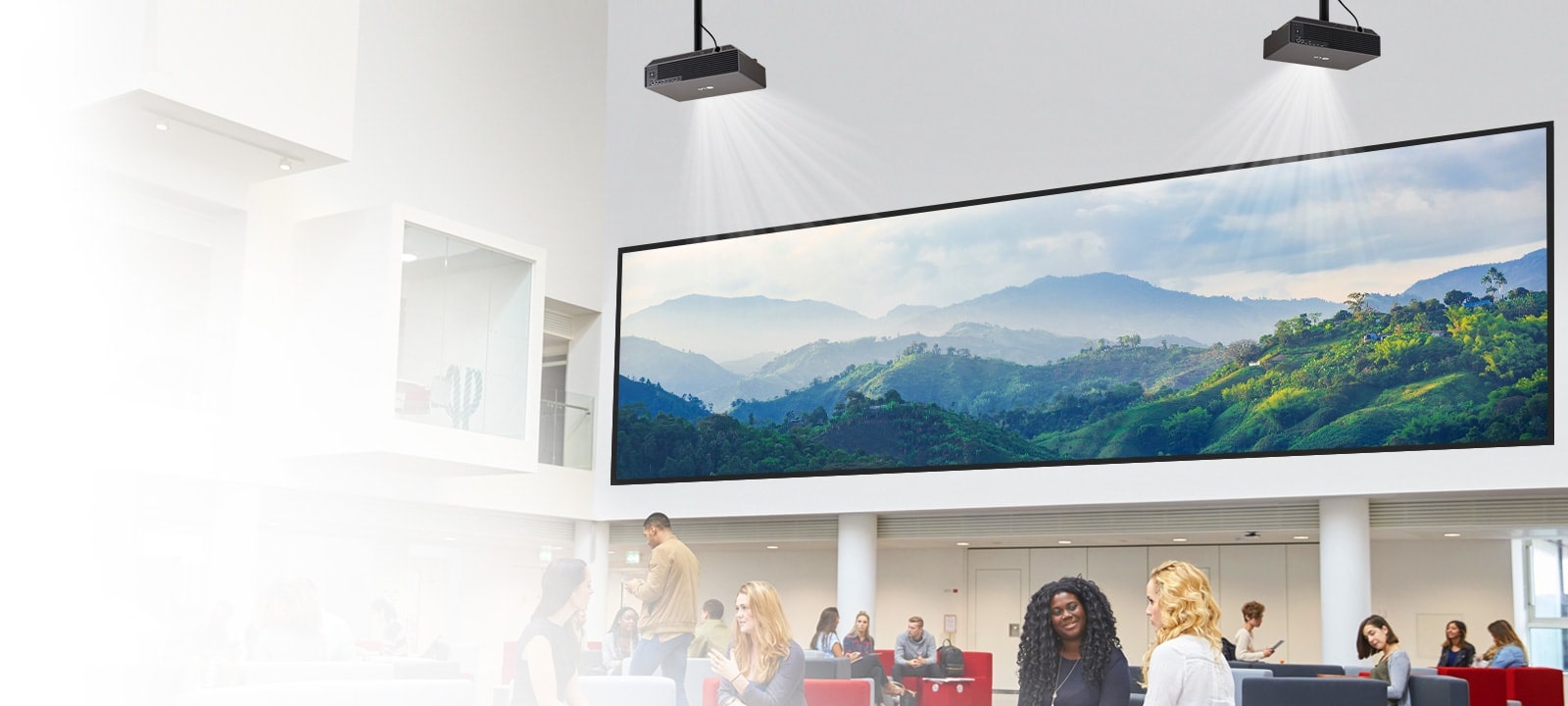 A projector in the lobby is displaying a mountain image on the wall.	