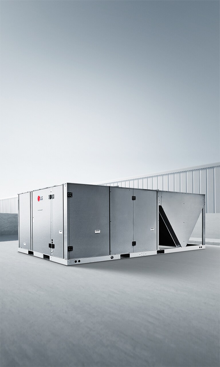 LG Inverter Single Package on a concrete platform with a clear sky and a building in the background.