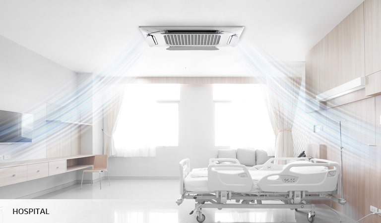 Hospital room bathed in soft, natural light, showcasing an LG HVAC Dual Vane system with an 'Indirect Wind' feature designed to prevent air from blowing directly on patients.