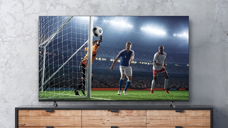 The soccer game scene shown on the TV screen appears real.