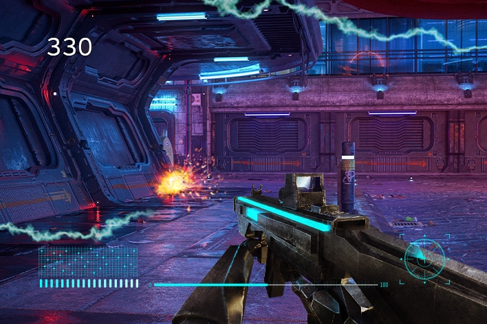 First-person shooter game scene inside a futuristic facility, showing a rifle aimed at a corridor with an explosion in the distance and the number 330 displayed on the screen.