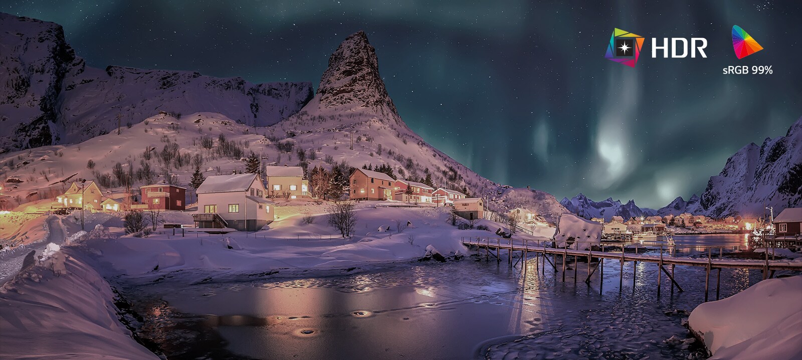 Split-screen comparison showing SDR versus HDR10 Pro with sRGB 99% color gamut, highlighting brighter highlights, deeper shadows, and more vivid color detail in a snowy village night landscape.