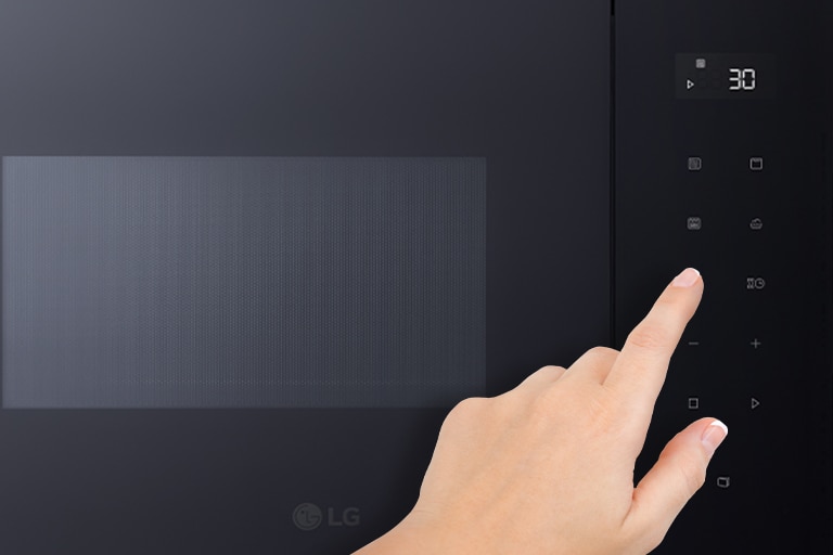 The Touch panel of Built-in microwave oven and the touching finger.