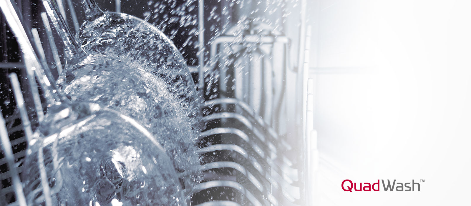 It shows a glass being washed with a stream of water.