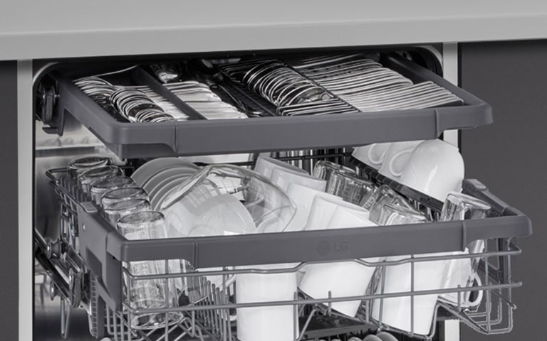 Showcasing how spatulas, spoons, forks, and knives are arranged in the 3rd rack of an LG freestanding dishwasher.
