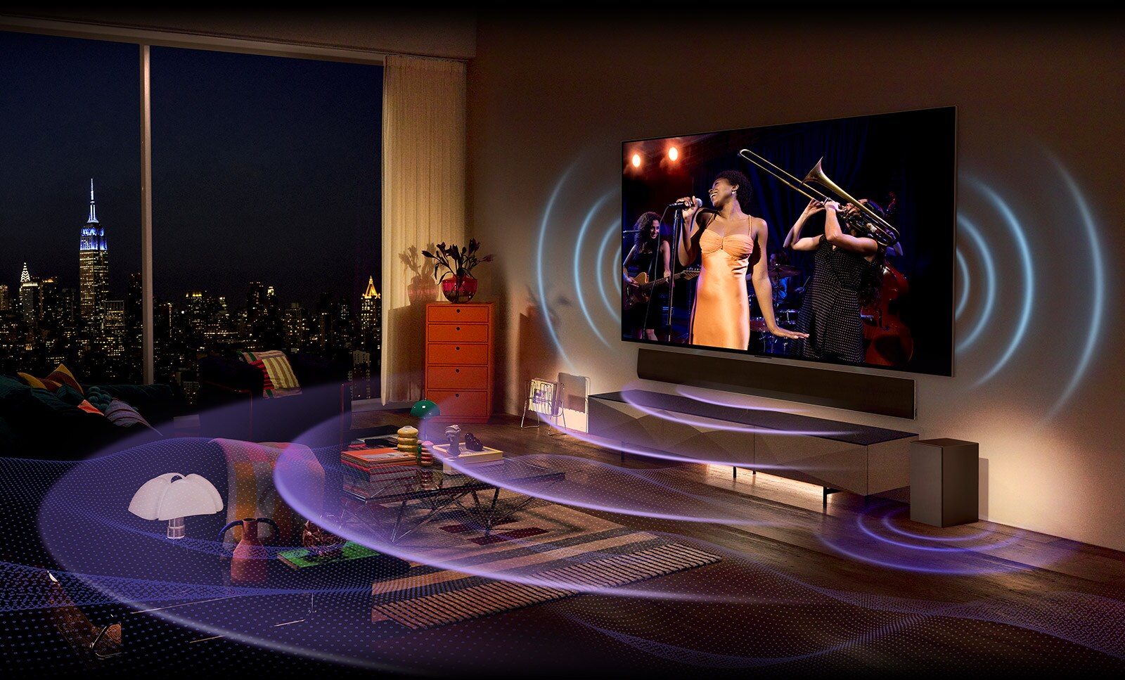 In a cozy living room, a large TV and soundbar are mounted on the wall. On both sides of the TV and below the soundbar, there is a wave graphic design that spreads wide and grand through sound.