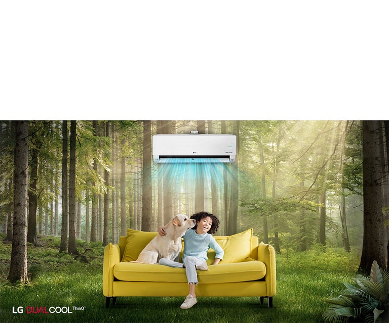 Children and pets are happy sitting on the couch in the forest, enjoying the air conditioning wind like natural wind.