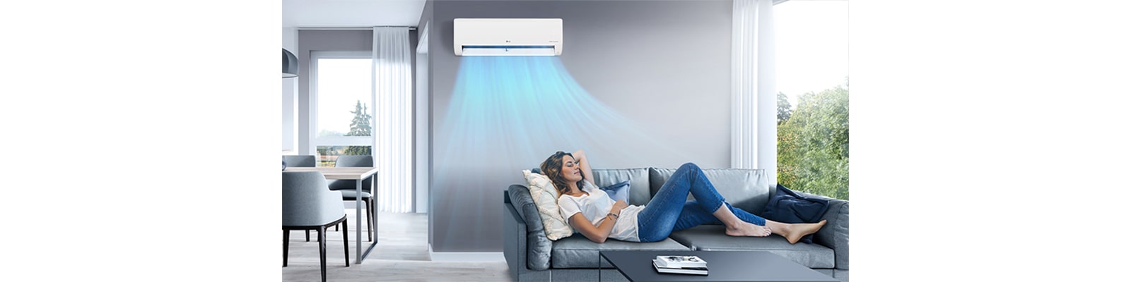 A woman resting on a sofa in the cool breeze of the air conditioner