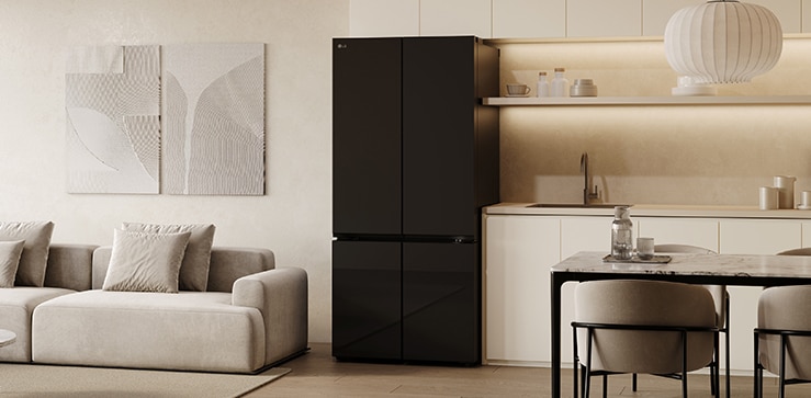 A cozy living room and kitchen are reflected in the sleek design of the lg multi door refrigerator with mirror doors.