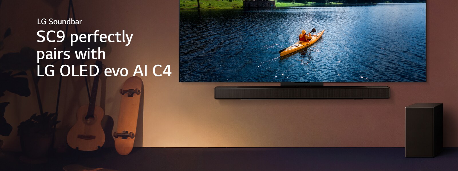 LG TV and Soundbar mounted on a wall and a suboofer on the floor to the right. On the TV, a person in a kayak on a lake is displayed, and soft shadows cascade over the wall.