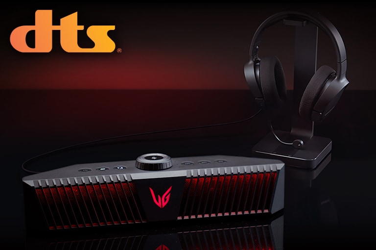 A gaming speaker is placed on black desk and there is a headset placed right behind - a DTS logo is placed on left top corner