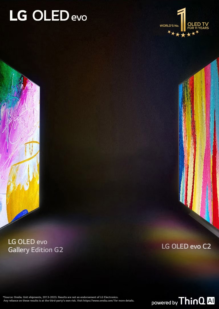 "A side view of the LG OLED C2 and LG OLED G2 Gallery Edition facing each other across a dark room with bright, colorful artworks on their screens.	  "