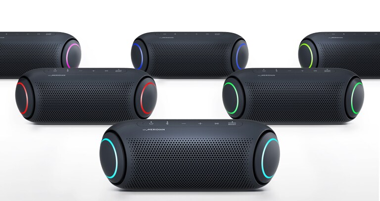 On a white background, five XBOOM Go show different color lighting.