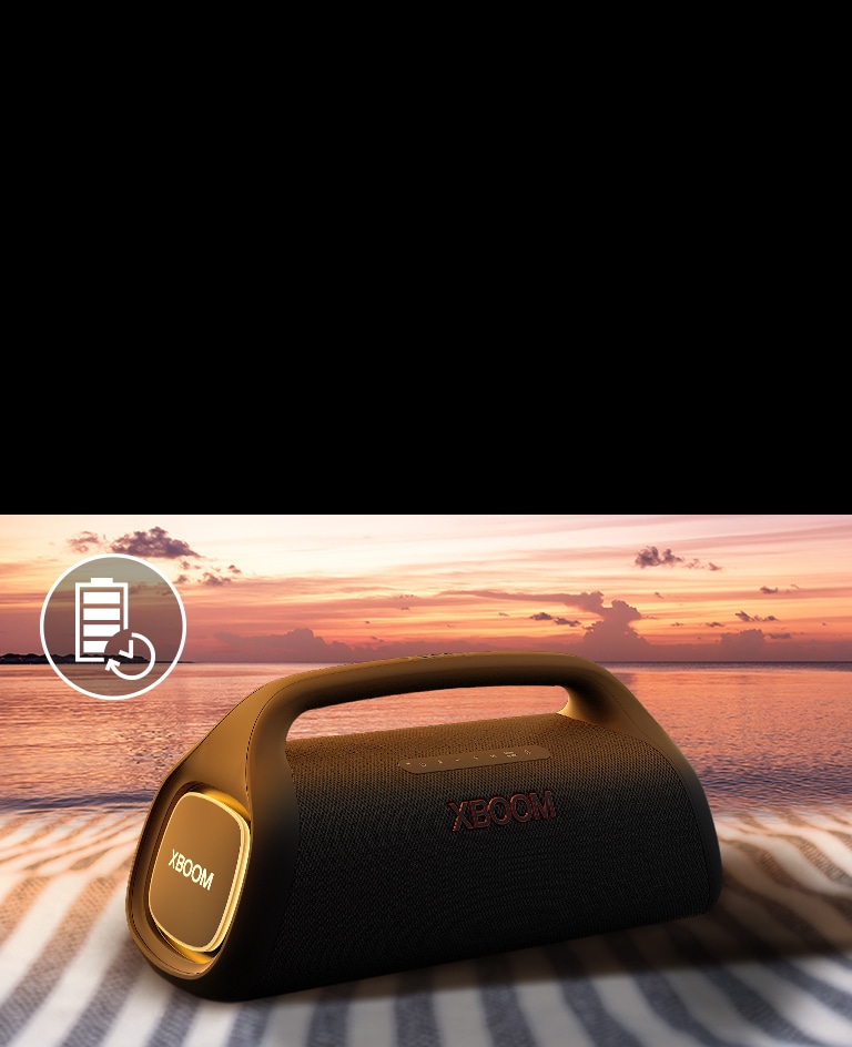 The speaker is placed on a beach towel. In front of the speaker, it shows sunset beach to illustrate that this speaker can be played longer.