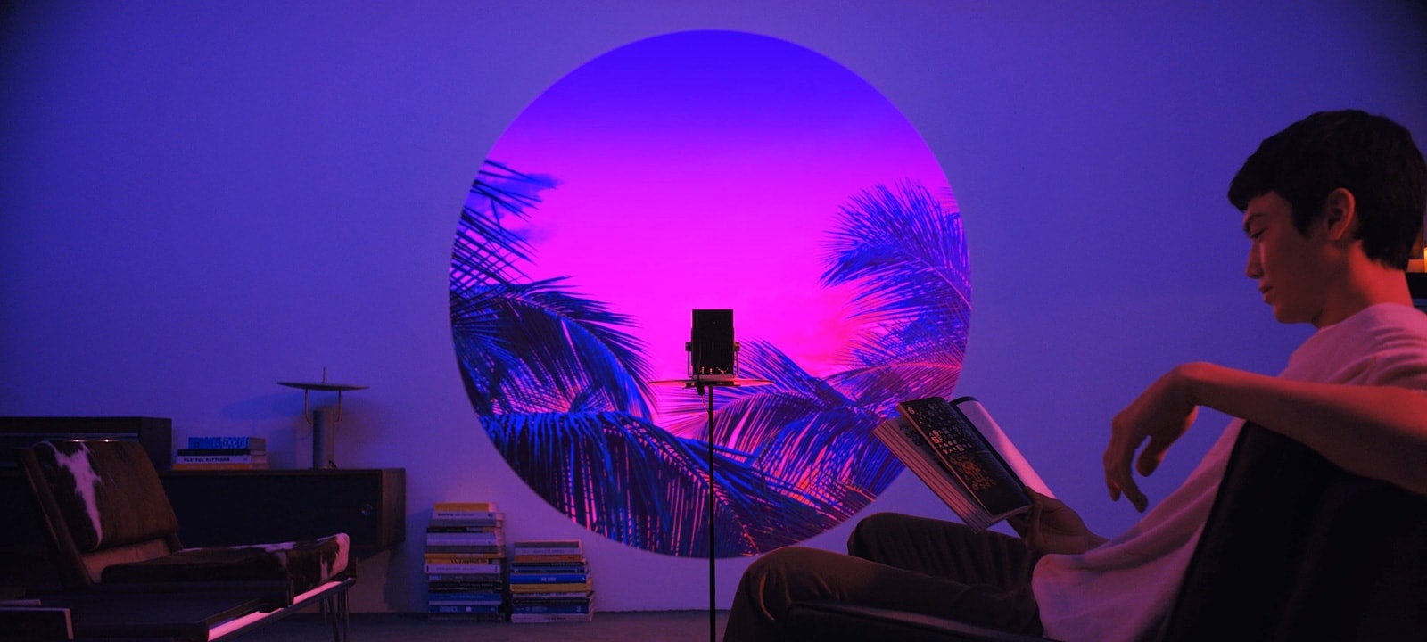 A scene showcasing the application of the light drawing feature - reading a book in living room.	