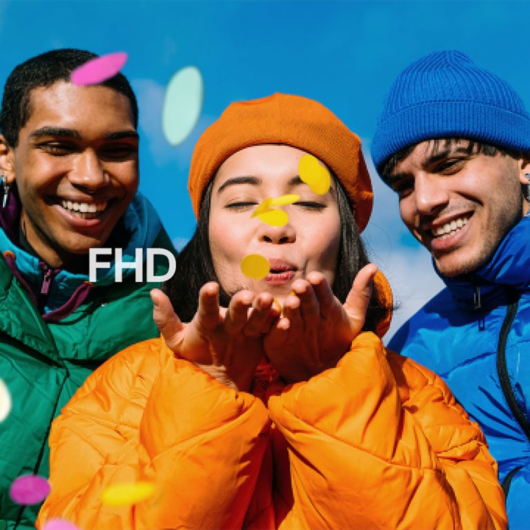 Three people wearing green, yellow, and blue outfits.