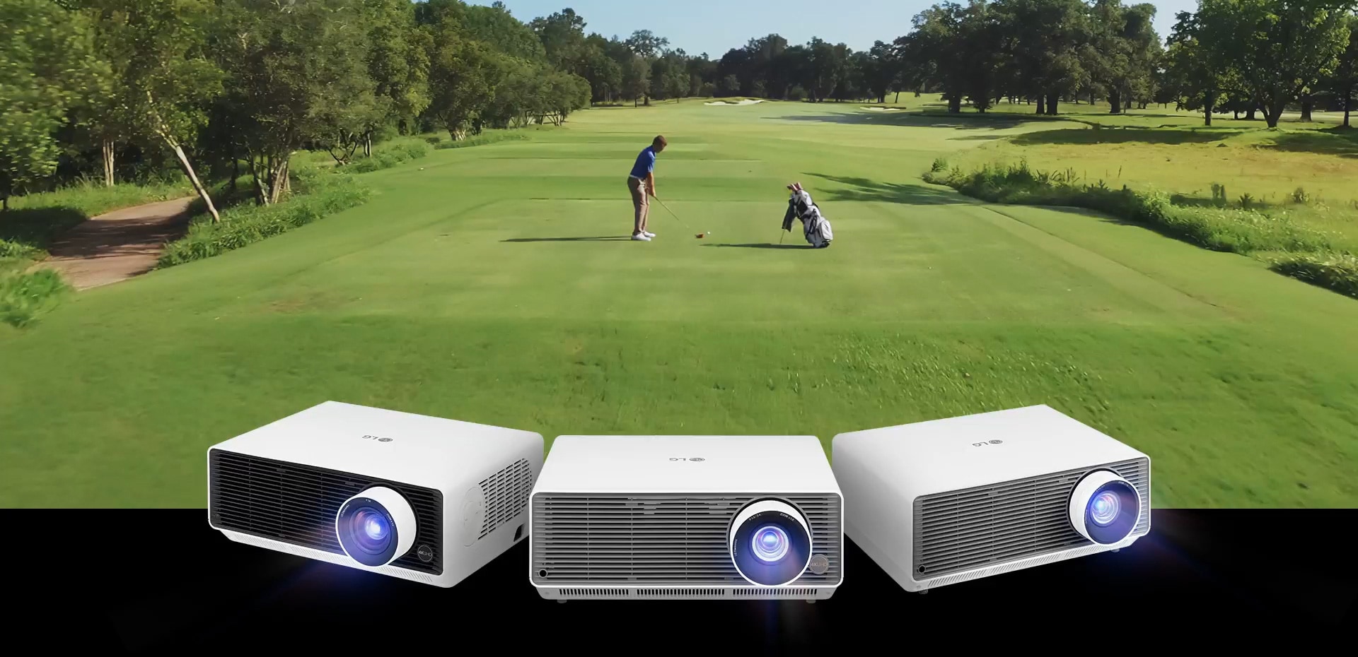 This is a video of a golfer hitting a ball on a golf course. Below are three LG ProBeam projectors with glowing lights.	