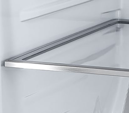 A diagonal view of the shelf with metallic paneling on the interior of the refrigerator.