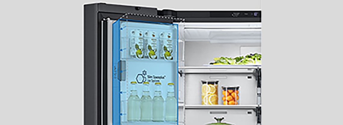 Inside the refrigerator, a slim indoor ice maker is highlighted in blue and the refrigerator is full of ingredients